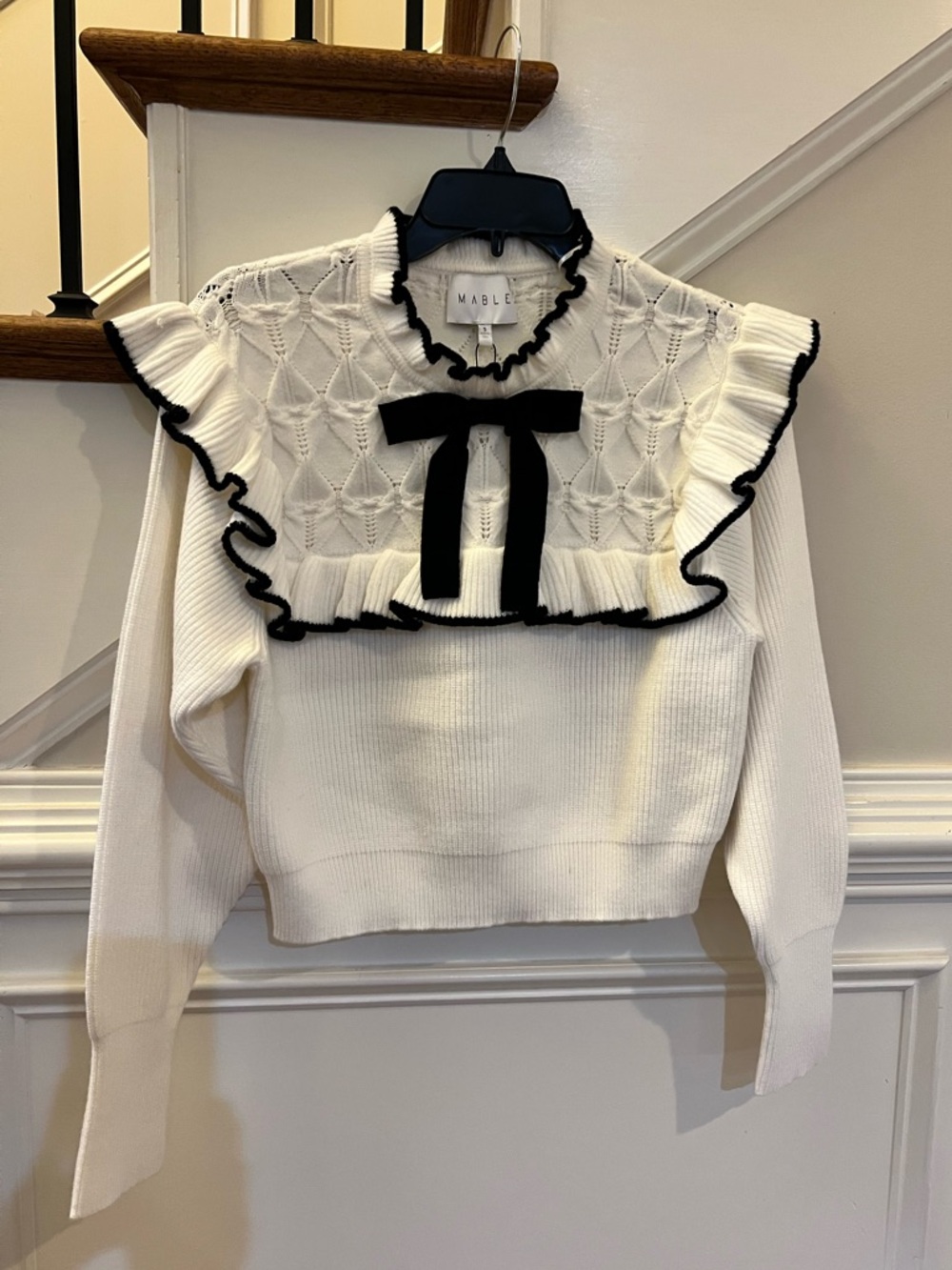 MABLE Soft White Sweater with Black Trim & Bow Accent